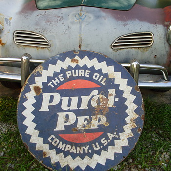 Old oil sign and bicycle.