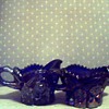 Dark blue, believe carnival glass, diamond cut on top, etc. creamer & sugar bowl. Can't find name to save my life. Someone HELP