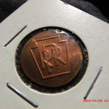 1976 Lincoln cent with the Pennsylvania Railroad logo. PRR
