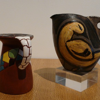 A Vallauris jug by KOSTANDA, Alexandre and a mystery candlestick.