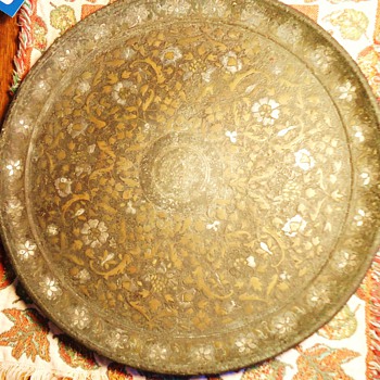 Metal Plate 11 1/2 inch Diameter, weighs 3.1 lb. very tarnished, non-magnetic, never seen one like this, need help