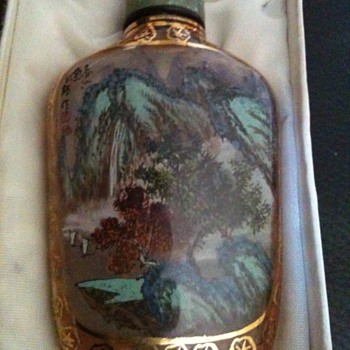 how old is this and who signed the paintings - Bottles