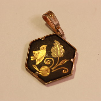 Gold and black enamel pendant