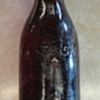 Brown Coke Bottle with One Arrow