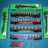 Marklin train cars, track with boxes.
