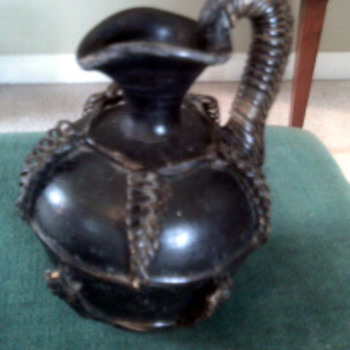 Unusual  Pottery  with wicker?