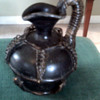 Unusual  Pottery  with wicker?