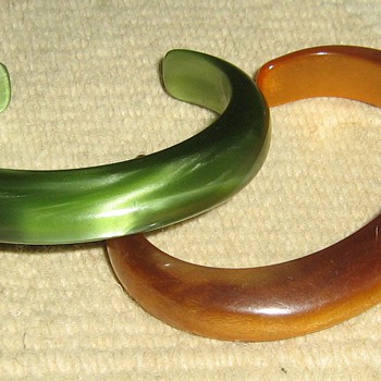 How old are these lucite & bakelite cuffs?