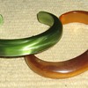 How old are these lucite & bakelite cuffs?