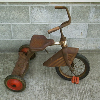 Unknown tricycle with skirted fender.