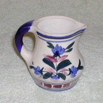 Stoneware pitcher with floral design