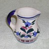 Stoneware pitcher with floral design