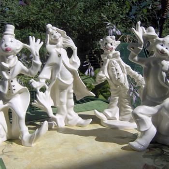 Porcelain Clowns trimed in Gold - Art Pottery