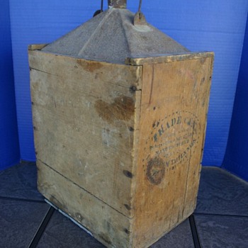 Wood encased oil can