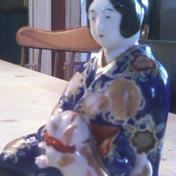 Oriental Girl Holding Dog