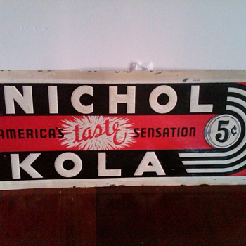 Nichol Kola embossed sign
