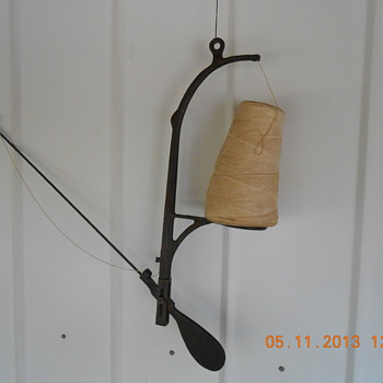Wall or ceiling mount string holder Odd but Very Nice