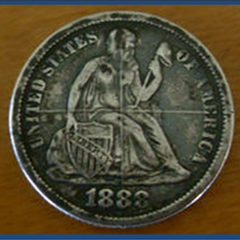 What is this?  DIE CENTERING CROSS HAIR ON COIN...