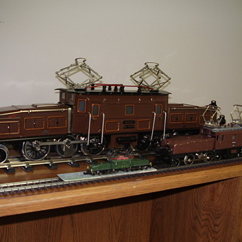 Mixed scale train engines and rolling stock
