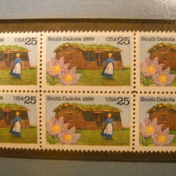 Framed stamps one with us postal license sticker on back