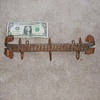 Trench art coat rack