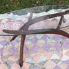 mid century coffee table with a Surfboard Glass Top and Teak bottom