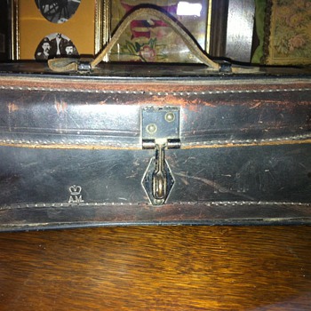 Metal and leather box stamped AM 1941
