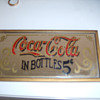 Help to Coca Cola sign