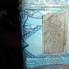Tobacco tin with John Q. Adams strap and 2 stamps on the bottom