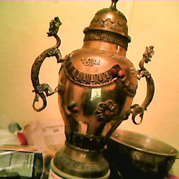 Large brass urn with dragon serpent handles
