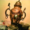 Large brass urn with dragon serpent handles