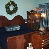 bed room and breakfast area and part of the library with old books