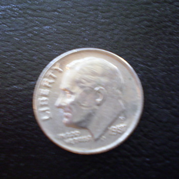 1987P Dime with circle around cheek and effecting the ear, 
