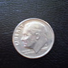 1987P Dime with circle around cheek and effecting the ear, 