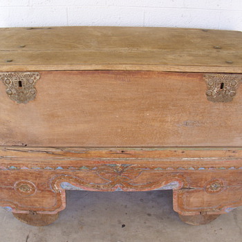 very old trunk/box with old cart with wooden wheels need any info on it
