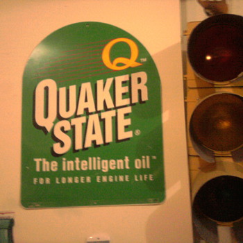 Quaker State sign and a 60"s era stop light in the garage...  You'll know it's our house!