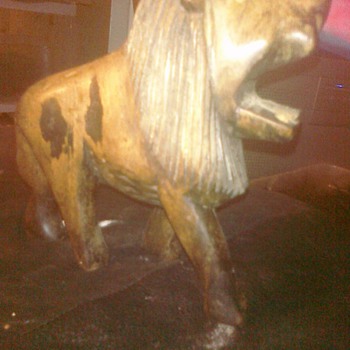Craved Lion 6ins tall . No noteable marking it weighs maybe a pound