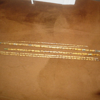 Old fishing rods and fishing rod walking stick
