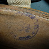 for tinlid, close up photo of stamp in Zukerman helmet