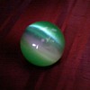 Jade Tiger's Eye Orb, gift from China 1 and 3/4 inches wide.