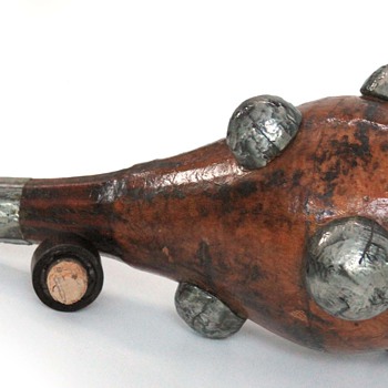 Leather bound bottle,  with silver lumps -  any ideas?
