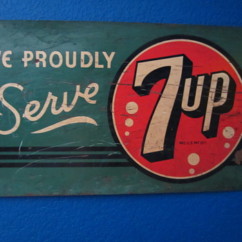 We Proudly Serve 7Up sign