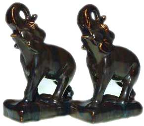 Pair of 7 1/2 inch “Trunk Up” elephant bookends, cast in 1951 and covered with the Nubian Black glaze Pair of 7 1/2 inch “Trunk Up” elephant bookends, cast in 1951 and covered with the Nubian Black glaze