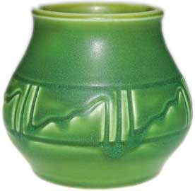 Squat Z line 3 3/4 inch vase encircled with a Native American style design and covered with a good mat green glaze in 1904 Squat Z line 3 3/4 inch vase encircled with a Native American style design and covered with a good mat green glaze in 1904