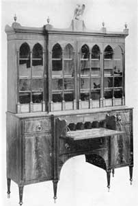 Illustration II: A Fine Salem Break-Front Secretary: This is an example of the high standard of Salem cabinets shipped South. It originally belonged in the English family. Their home was in the "Mary Land Tract" between Frederick and Brunsurick, Maryland. Illustration II: A Fine Salem Break-Front Secretary: This is an example of the high standard of Salem cabinets shipped South. It originally belonged in the English family. Their home was in the "Mary Land Tract" between Frederick and Brunsurick, Maryland.