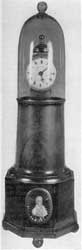 A Lighthouse Clock: This presentation clock, by Simon Willard, has glass bell cover and mahogany case. In the base is set a portrait medallion of Lafayette. A Lighthouse Clock: This presentation clock, by Simon Willard, has glass bell cover and mahogany case. In the base is set a portrait medallion of Lafayette.