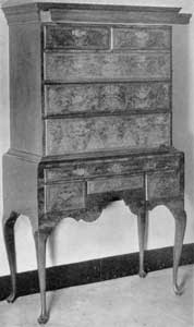 ILLUSTRATION VI: A Queen Anne Flat-Top Highboy: The drawer concealed behind the cornice molding has been opened to show its size and location. ILLUSTRATION VI: A Queen Anne Flat-Top Highboy: The drawer concealed behind the cornice molding has been opened to show its size and location.