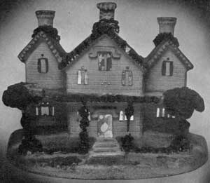 A Victorian Cottage in Chalk: This very rare mantel ornament has pierced windows fitted with colored glass. At the back are candle holders. When lighted, these shine brightly through the windows. Probably made for use at Christmas. The house follows the East Lake Gothic design. avictoriancottage