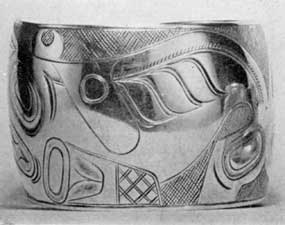 Illustration IX: Bracelet by Edenshaw: Made about 1890, it is typical of the fine work of this Indian craftsman of the Haida tribe of the Queen Charlotte Islands. Illustration IX: Bracelet by Edenshaw: Made about 1890, it is typical of the fine work of this Indian craftsman of the Haida tribe of the Queen Charlotte Islands.
