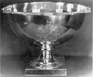 By Rebecca Eames and Edward Barnard: This piece is dated 1616, but the partnership, located Amen Corner, registered their mark in 1808. The bowl on square foot with gadroon and shell border stands 8 inches high and is 11 1/2 inches in diameter. By Rebecca Eames and Edward Barnard: This piece is dated 1616, but the partnership, located Amen Corner, registered their mark in 1808. The bowl on square foot with gadroon and shell border stands 8 inches high and is 11 1/2 inches in diameter.